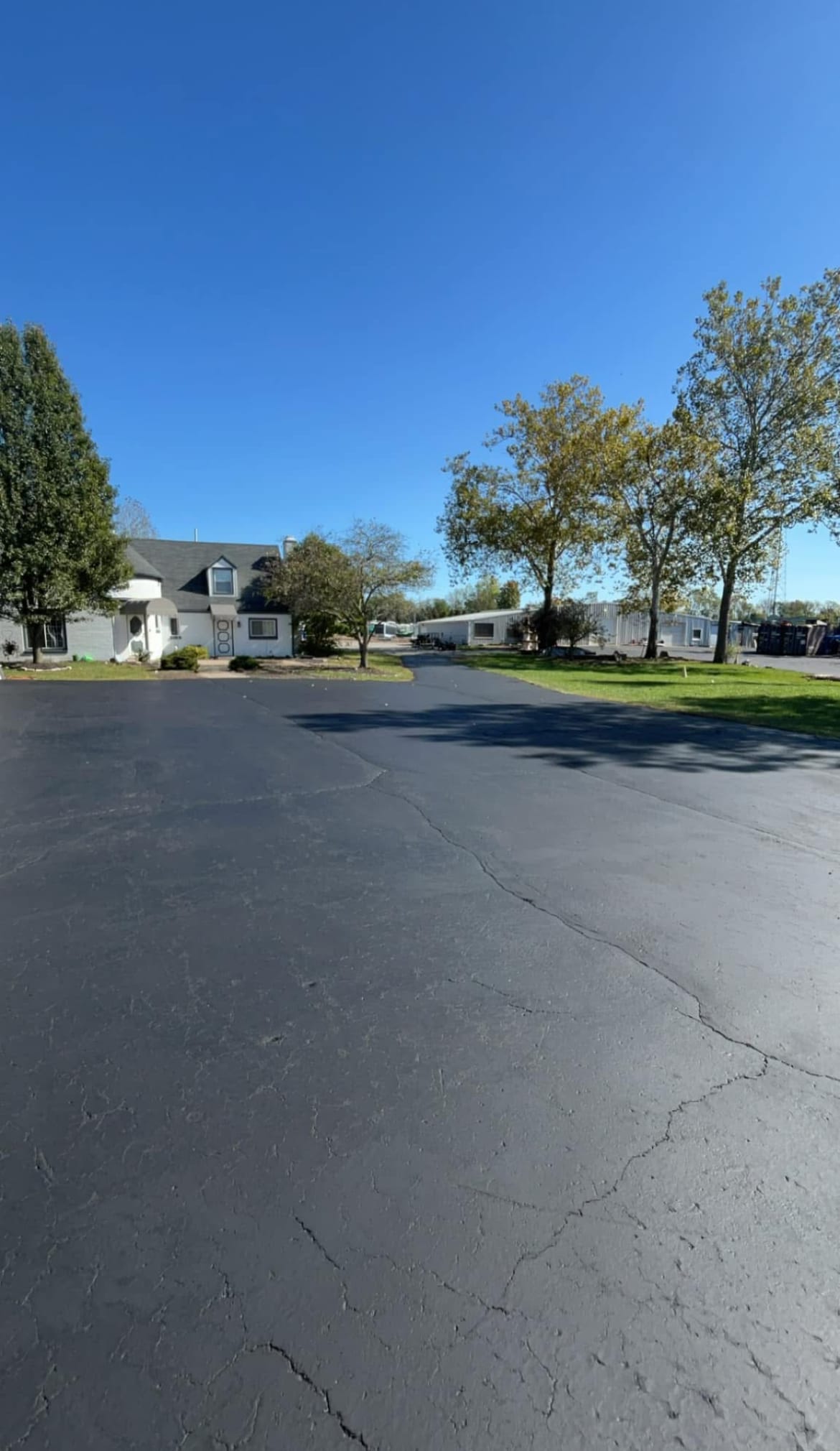 Asphalt with cracks repaired before sealcoating